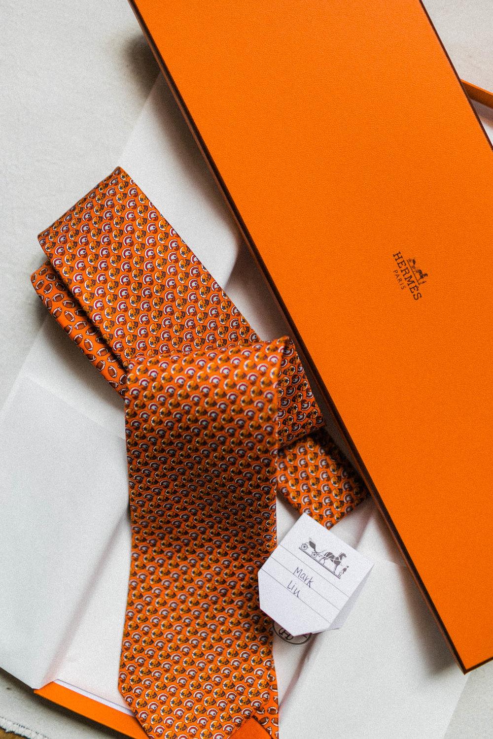Jeff gifted his groomsmen with these personalized  Hermes  ties.