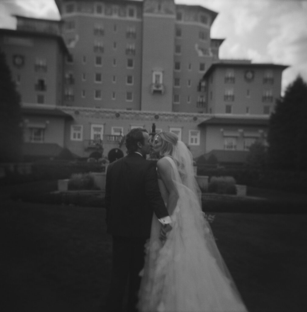 Wedding portraits in front of the iconic Broadmoor front lawn in Colorado Springs, Colorado.